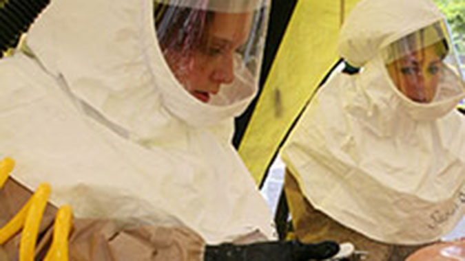 A nurse from Tennessee decontaminates a simulated patient during a mass casualty exercise at the Center for Domestic Preparedness (CDP). Ten hospitals representing the northeast region of Tennessee sent 37 employees to the CDP’s Hospital Emergency Response Training for Mass Casualty Incidents (HERT)