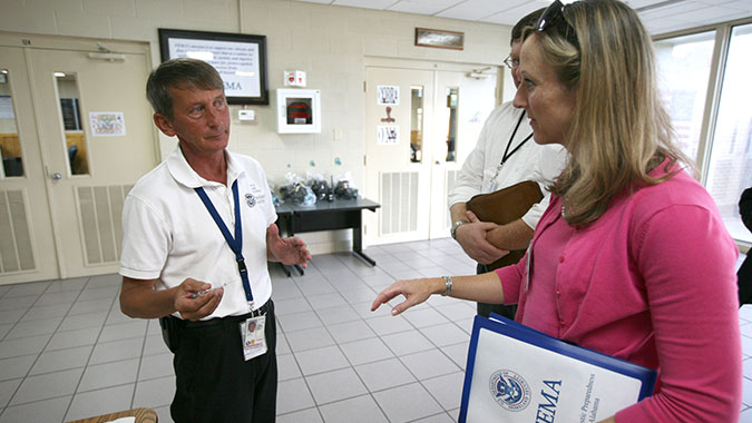 Woody Davis (LEFT), COBRA TF Operations officer, briefs a visitor on COBRA operations.