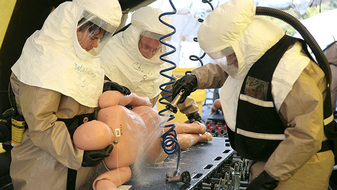 Healthcare professionals attending training at the CDP decontaminate a simulated disaster survivor. These responders are from New Jersey, preparing for Super Bowl 48.