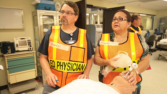 Tribal healthcare professionals respond to a mass casualty event in the emergency department (ED) of the Noble Training Facility (NTF) at the CDP. The NTF is the only hospital in the nation solely dedicated to preparing the healthcare, public health, and environmental health communities for mass cas