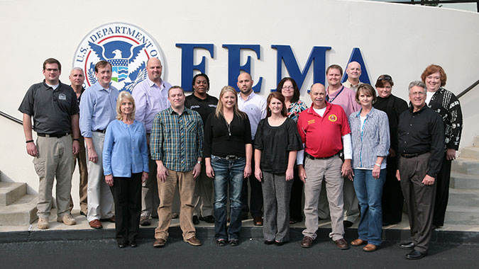 Members of the Emergency Management Coalition of Eastern Alabama pose for a photo at FEMA's Center for Domestic Preparedness (CDP). The coalition recently toured the CDP during its quarterly meeting. Front Row L to R - Denise Cooey (Deputy Director EMA Etowah Count.), Dr. Eric Best (JSU), Ashley Sis