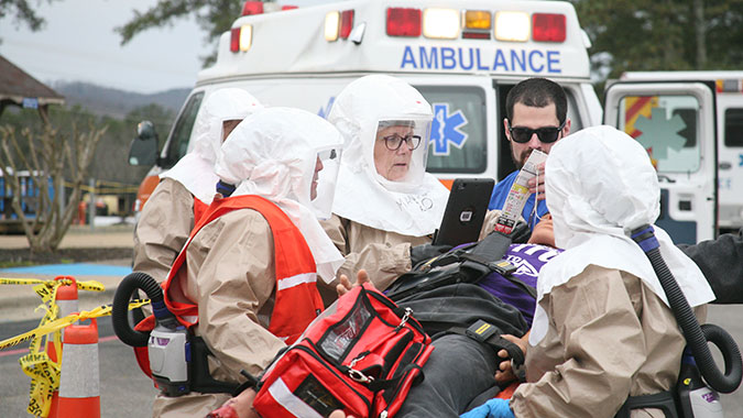 A team assesses the status of an arriving patient during a mass casualty exercise. The students were among the more than 175 representatives from 54 Tribes and Tribal Agencies who attended the CDP’s 2018 Tribal Training Week, March 19-23. (Photo by John Van Winkle)