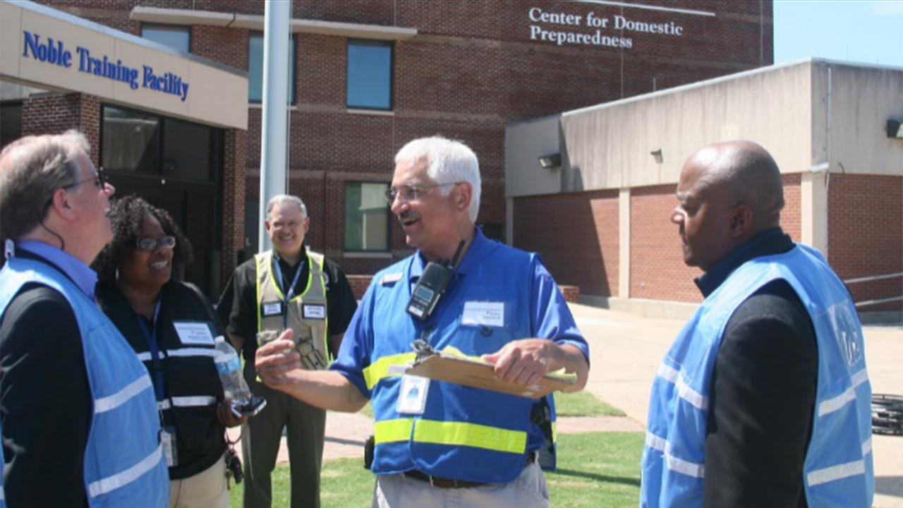 U.S. Senator Doug Jones (D-AL), left, enjoys a lighter moment with members of the CDP team, including (l-r) Malanie English, Charles Reneau, Pete Zekoff and CDP Superintendent Tony Russell. Jones toured the CDP June 29 and got the chance to see healthcare students taking part in a mass casualty and