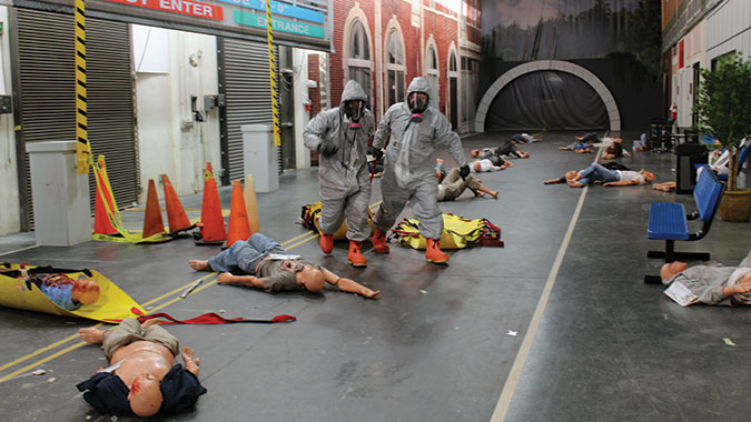 Students in the Emergency Medical Operations for CBRNE Incidents (EMO) course pull survivors from the contaminated incident scene during the Integrated Capstone Event, Nov. 20. The scene was staged in the CDP's Advanced Responder Training Complex's Indoor Street Scene training venue, which includes