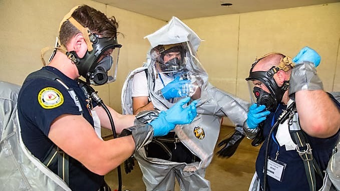 Responders don protective suits during hazardous materials training at the CDP.