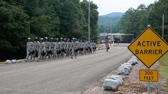 Members of the California U.S. Army National Guard’s 185th Military Police Battalion march to form a line protecting a government facility from possible illegal protest. The Guard members were part of more than 110 other soldiers participating in law enforcement training at the CDP.