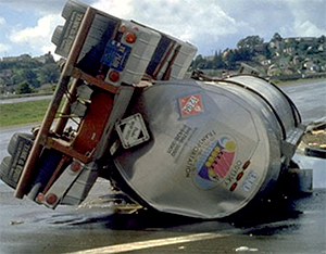 Image of an overturned hazmat tanker trailer.