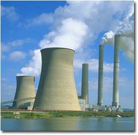 Nuclear power plant in collage with tri-blade radiation symbol