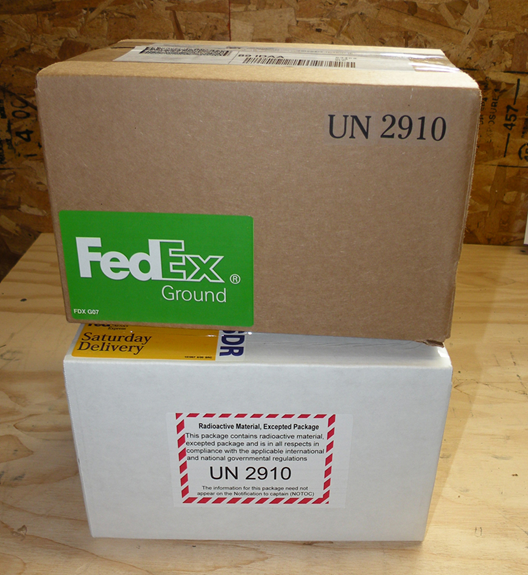 FedEx boxes marked with UN package number 2910