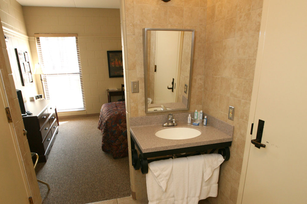 A personal sink is in each room. Towels and wash cloths are provided. Complementary toothbrush, toothpaste, soap, shampoo, conditioner, razor, and tissues are available.